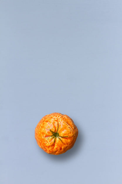 Mandarina réplica de cerámica esmaltada